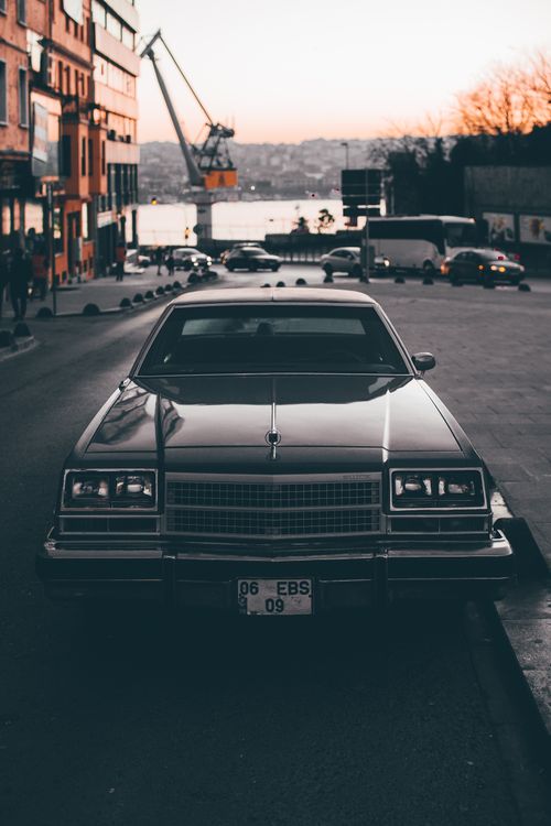 Free A classic vintage car parked on an İstanbul street at sunset near the Bosphorus. Stock Photo