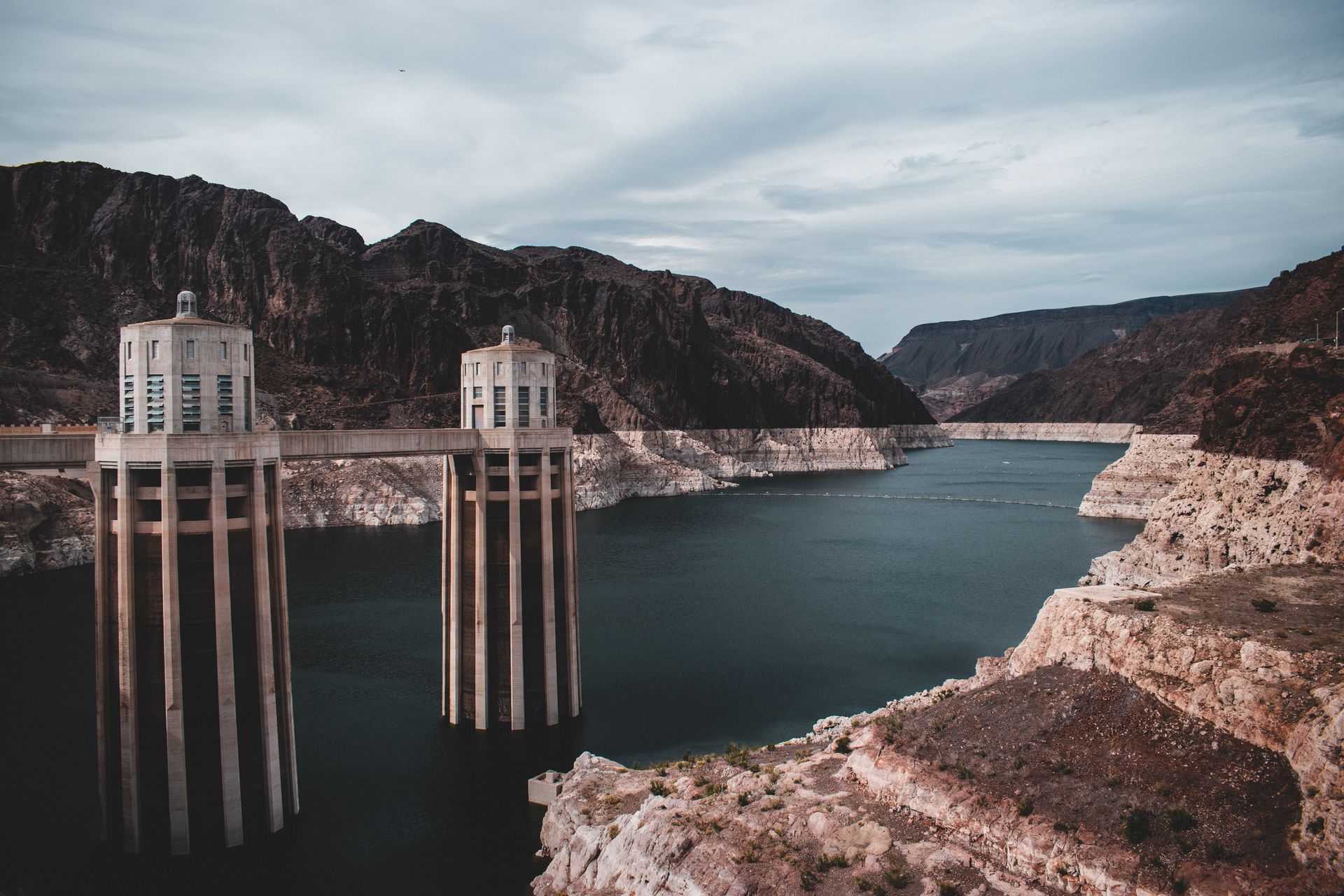 Stunning aerial shot of Hoover Dam and Lake Mead in the United States with dramatic landscape.