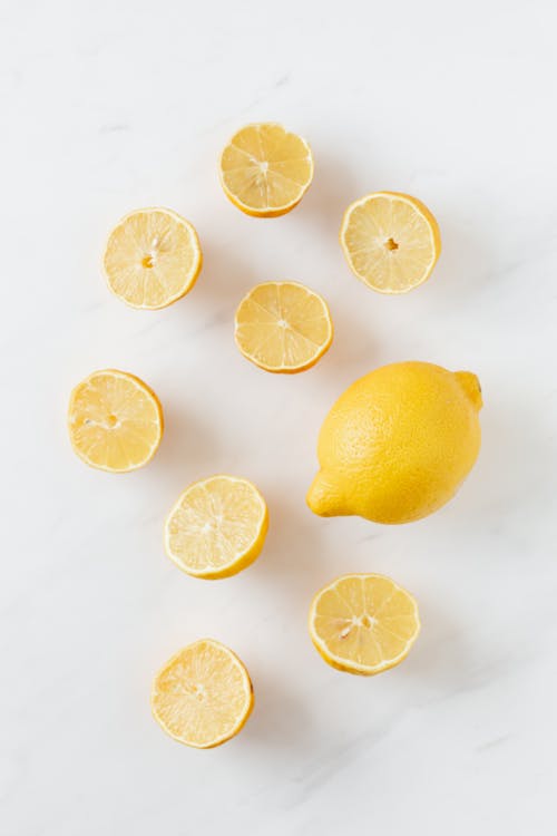 Free Fresh Lemons on a Marble Surface Stock Photo