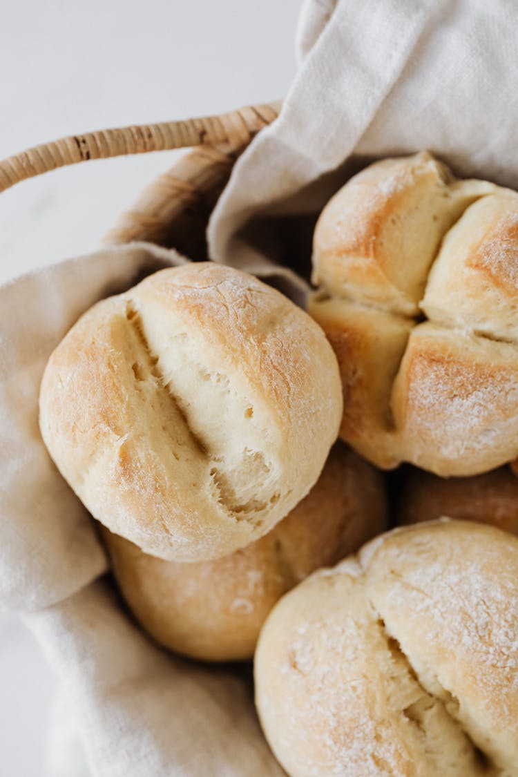 Freshly Baked White Bread Buns In A Basket