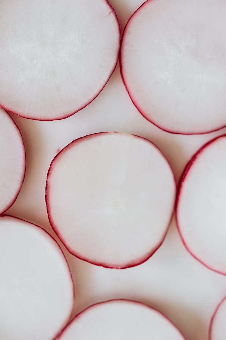 Radish Slices On White Surface