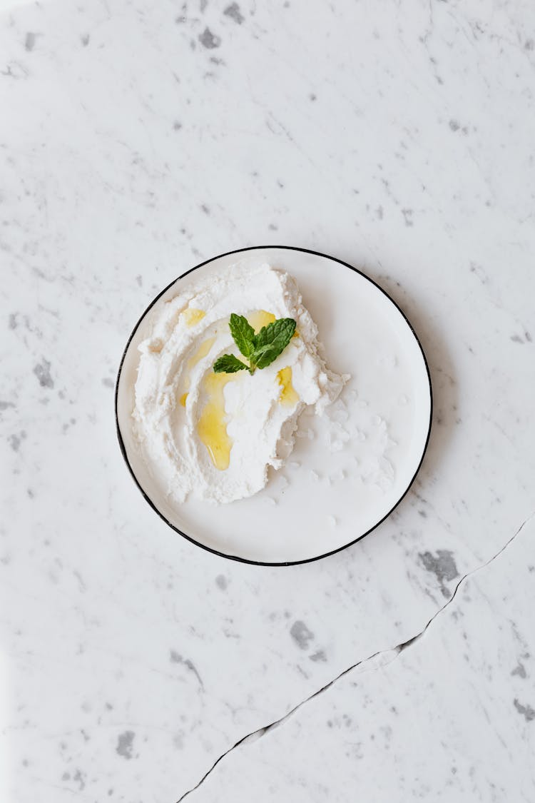 Cottage Cheese In Plate Placed On Table