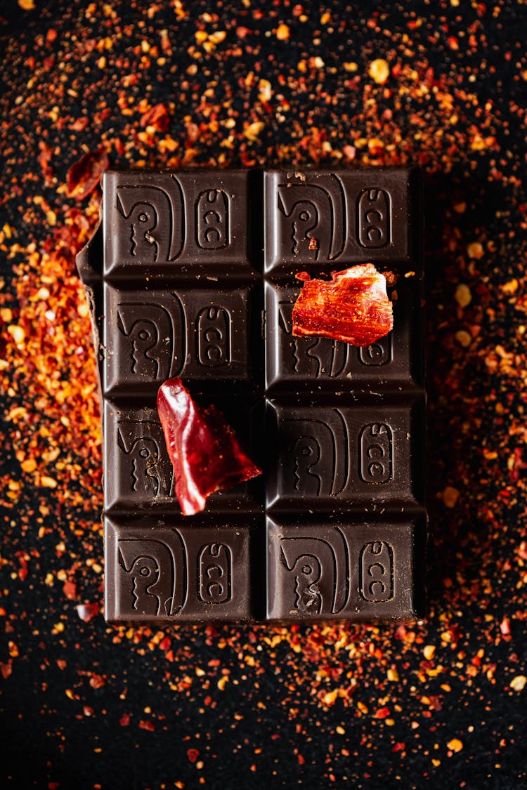 Pieces Of Hot Red Pepper On Dark Chocolate