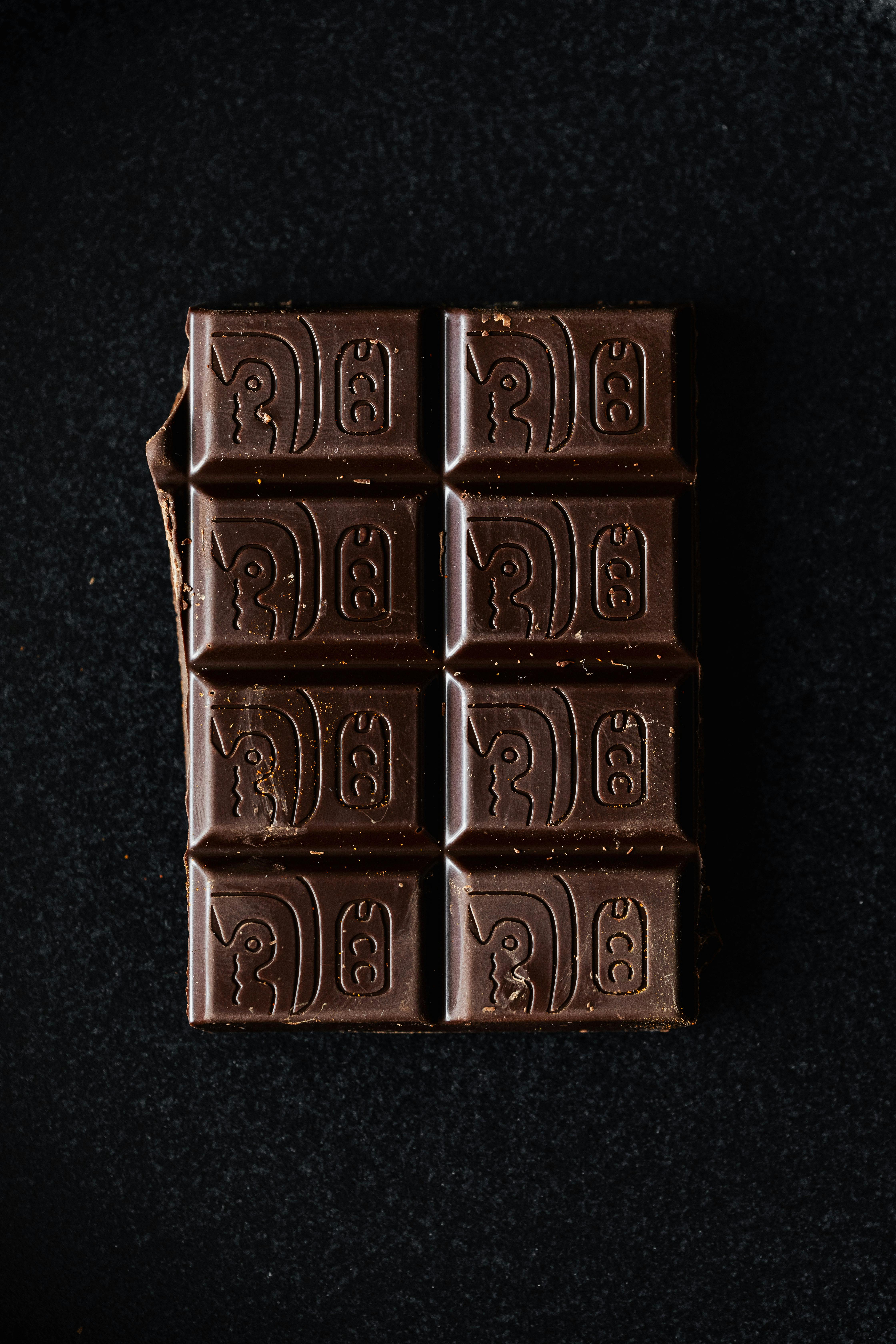 dark chocolate bar on black surface