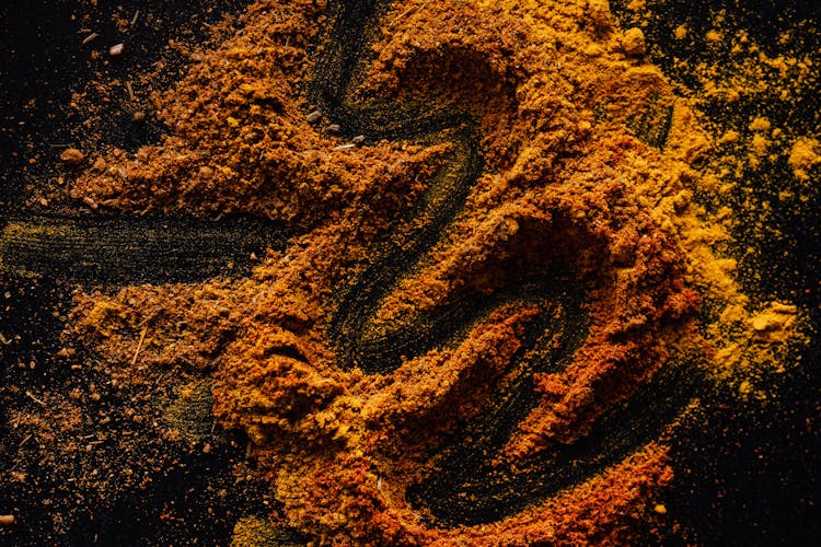 Mix Of Dried Colorful Spices On Black Background