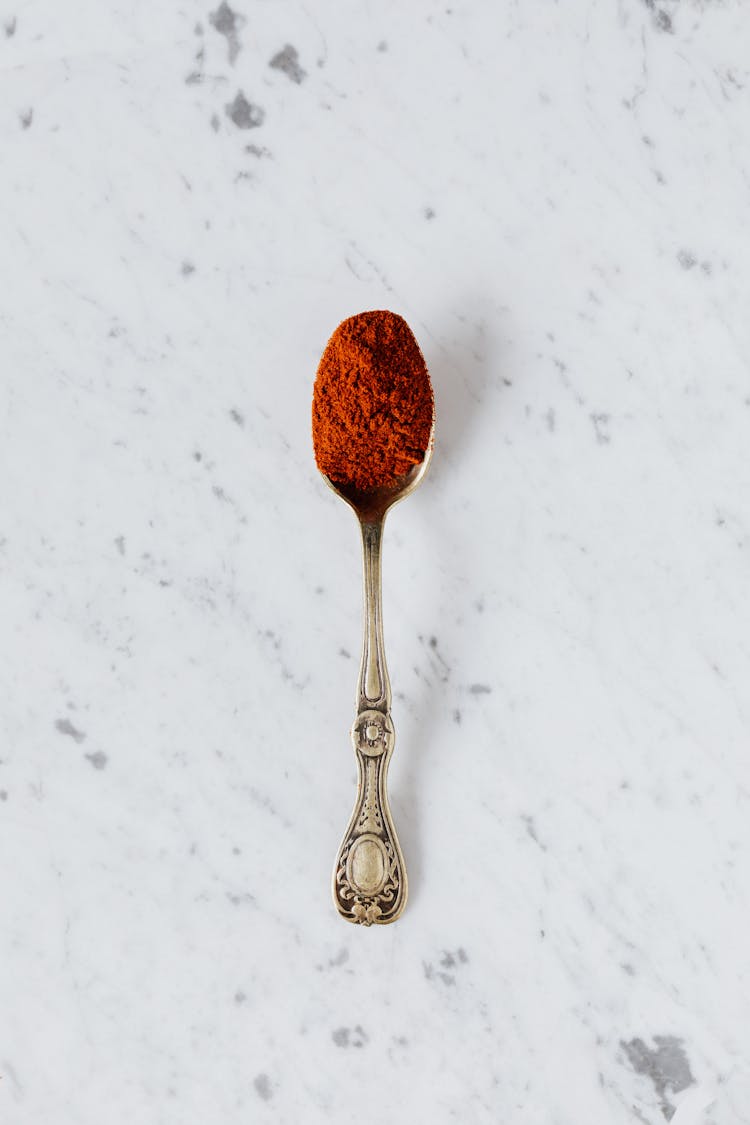 Silver Spoon With Red Paprika Powder