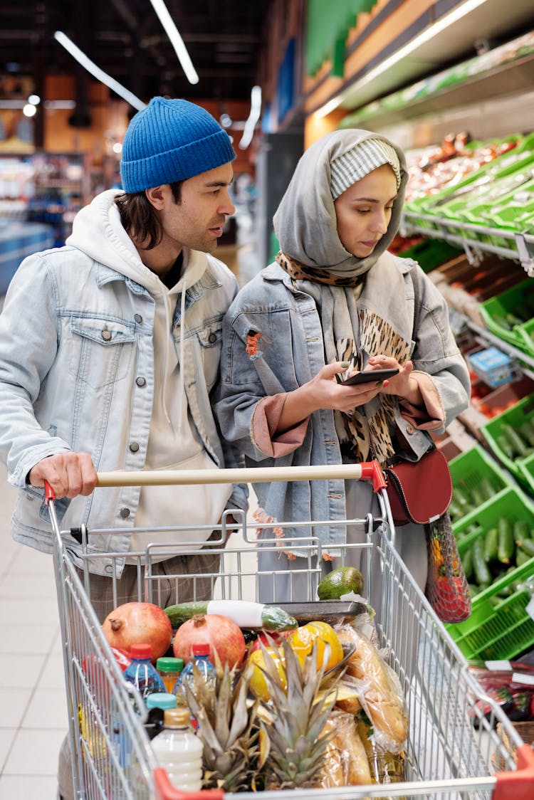 Couple Buying Groceries At A Supermarket