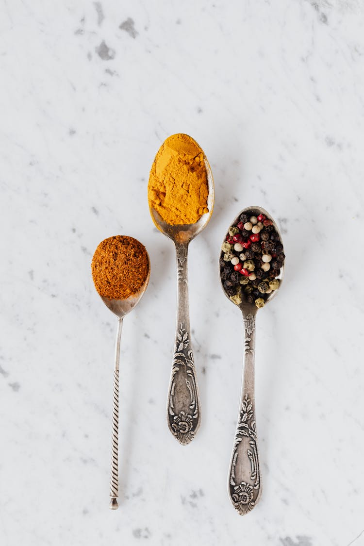 Set Of Aromatic Condiments In Vintage Spoons