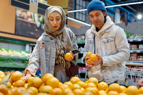 Couple Buying Oranges
