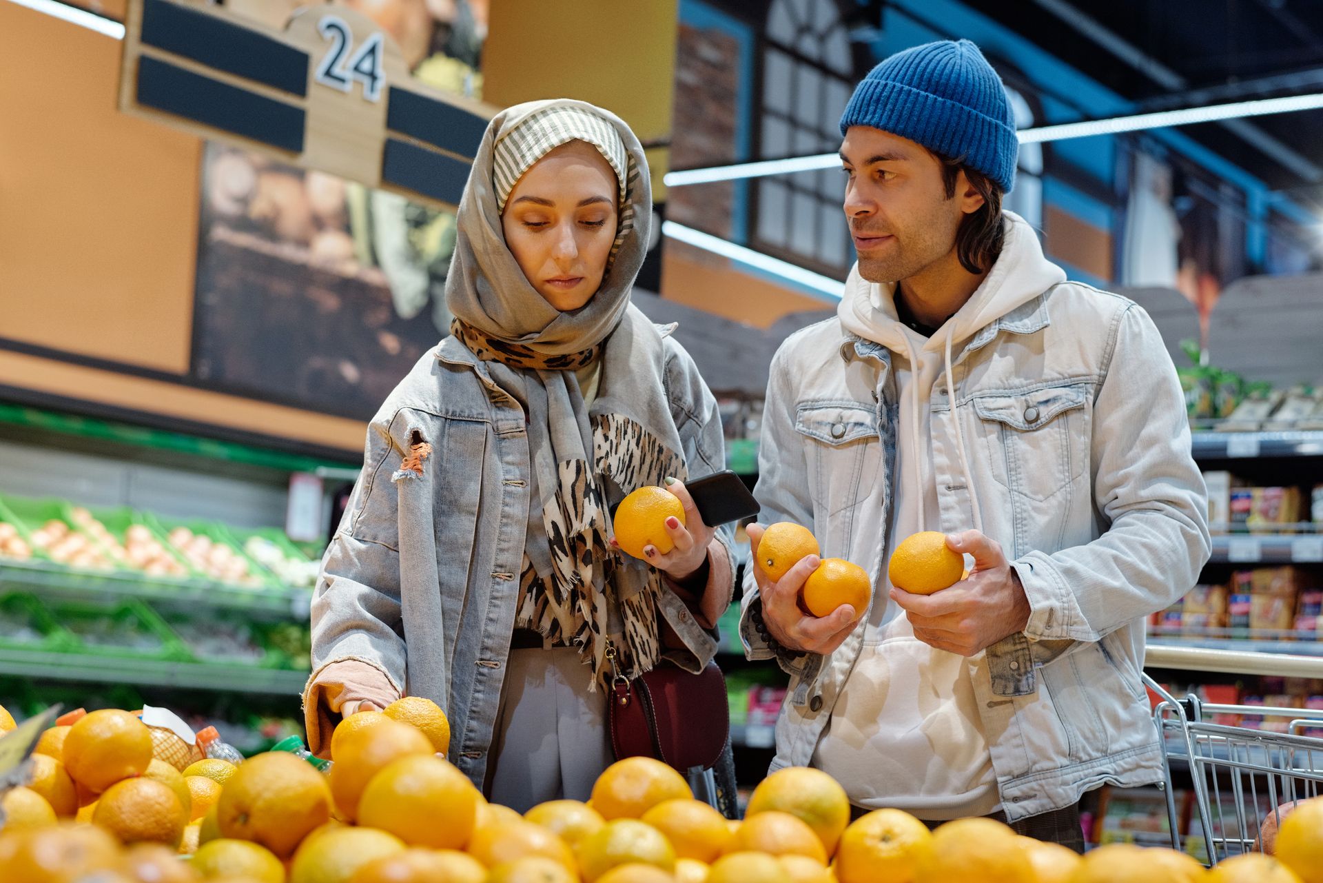 Couple Buying Oranges