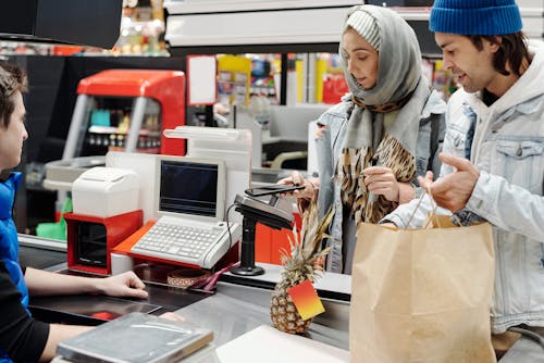 Couple Buying Groceries at a Supermarket