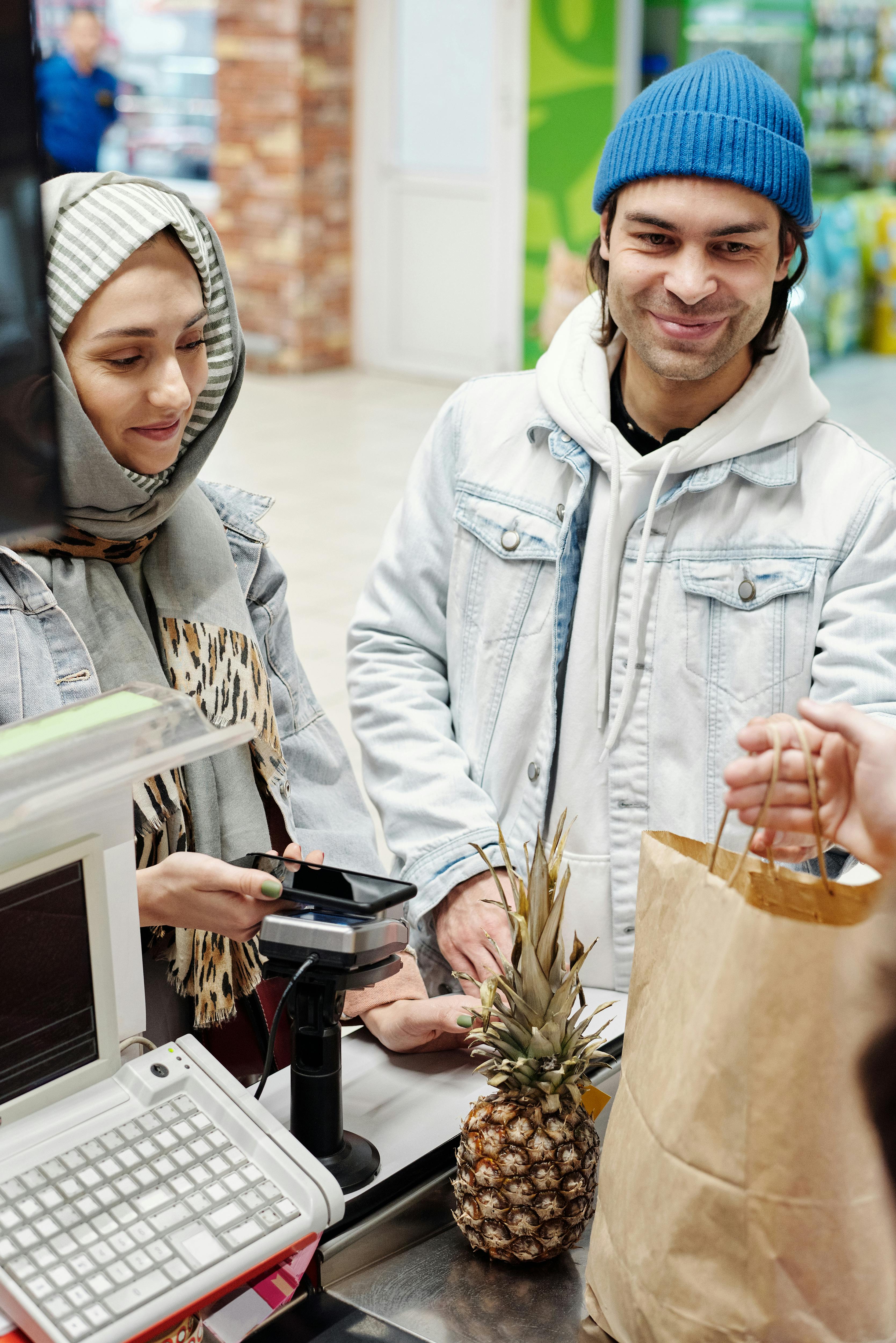 couple buying a pineapple