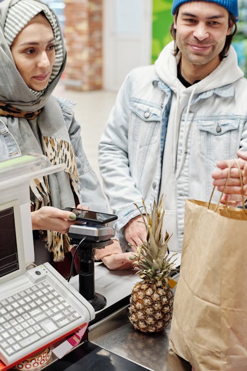 Free Couple Buying a Pineapple Stock Photo