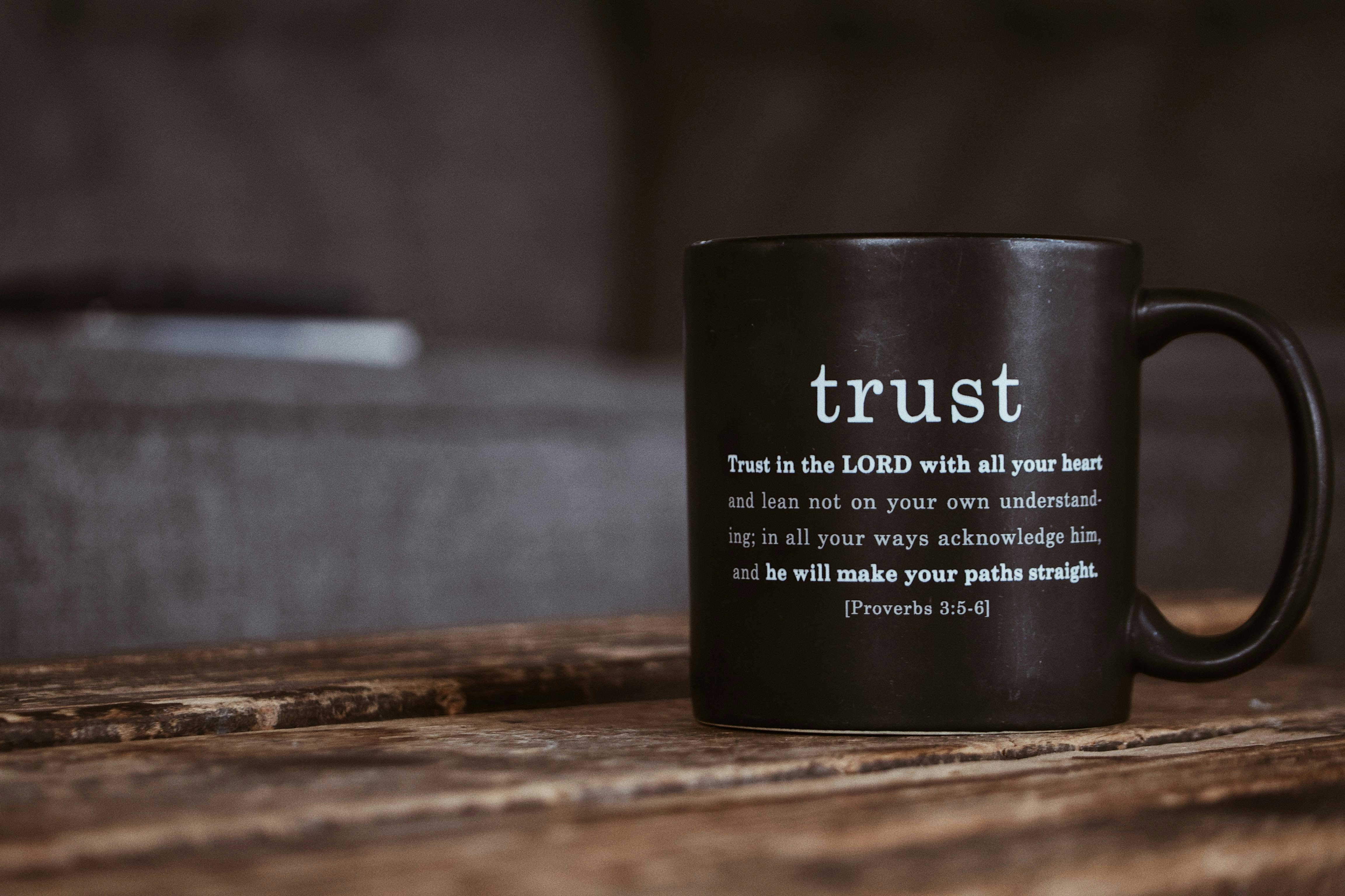 black mug with religious text from holy bible