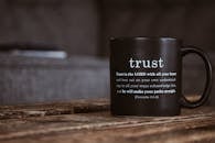 Black mug with religious text from Holy Bible