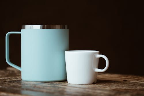 Blue and white mugs placed on shabby table