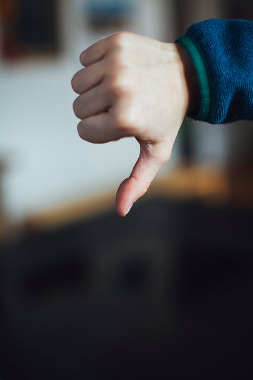 Free Person Doing Thumbs Down Stock Photo