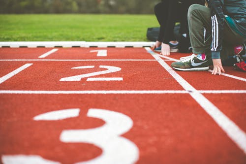 Fotos de stock gratuitas de campo de atletismo, carrera, cinta de correr