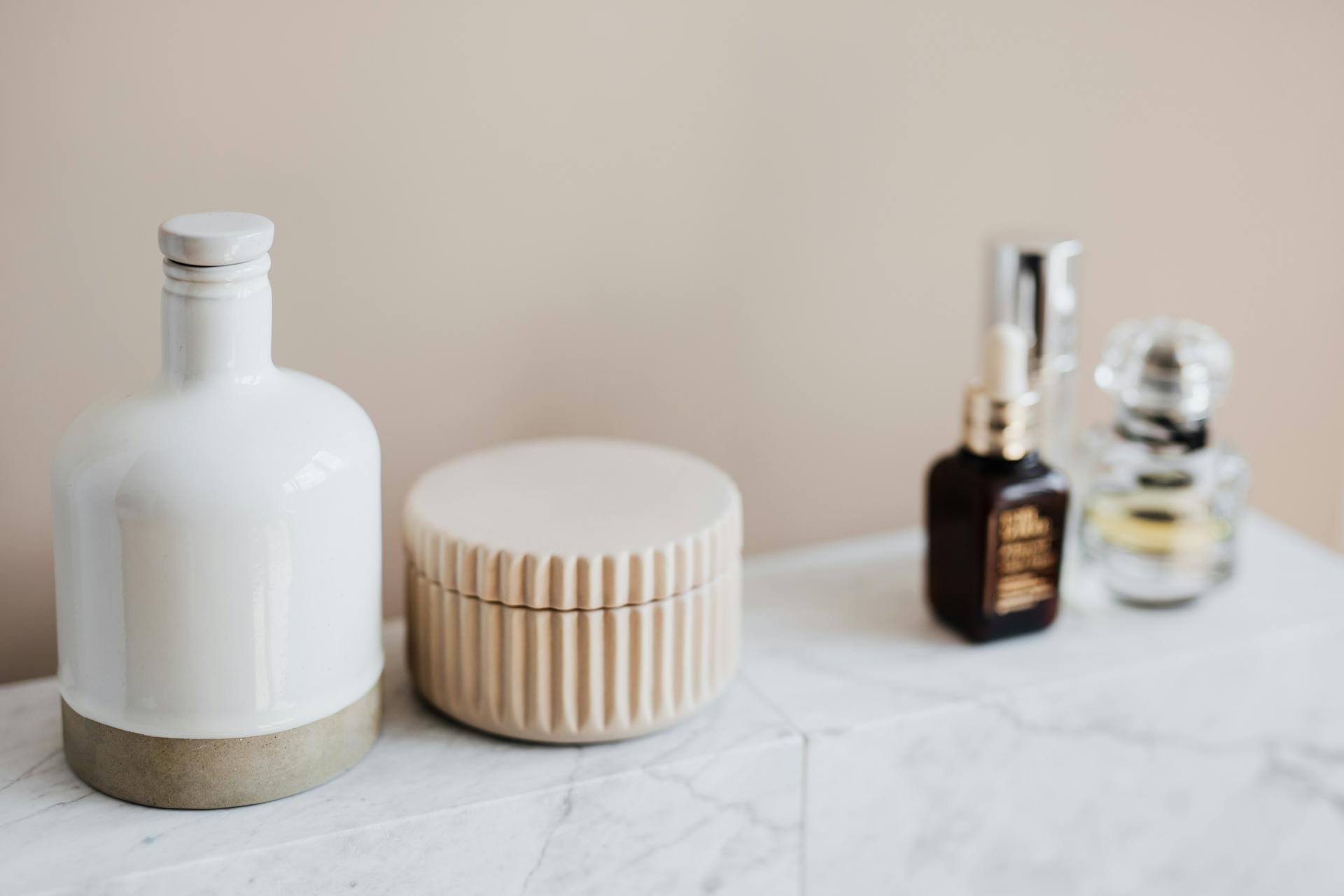 Marble shelf for cosmetics storage in modern bathroom