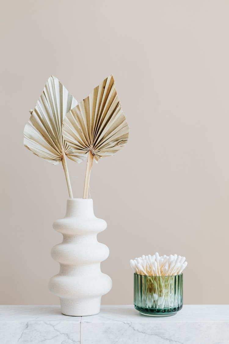 Vase With Decorative Leaves And Container With Cotton Buds