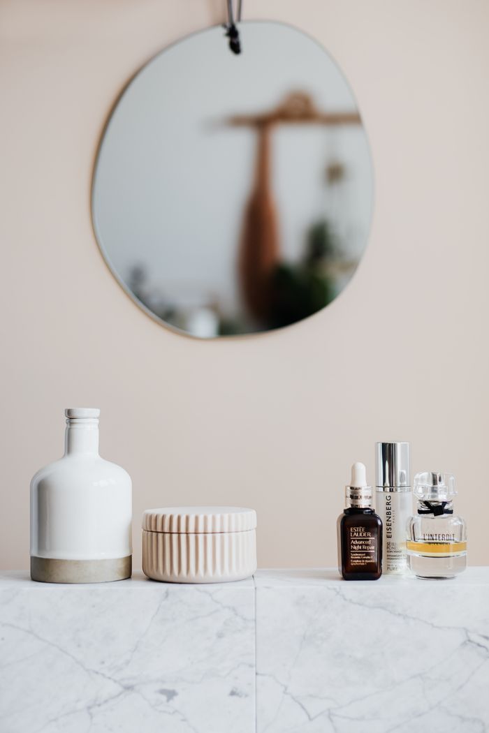 Natural skincare products arranged on a stone surface