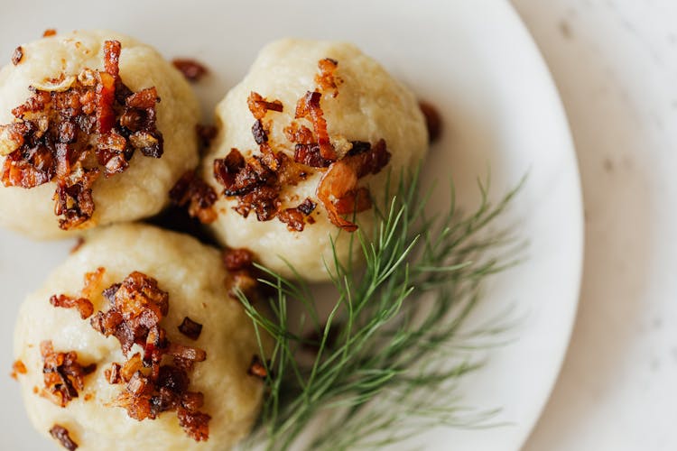 Potato Dumplings With Toasted Bacon And Dill Sprig