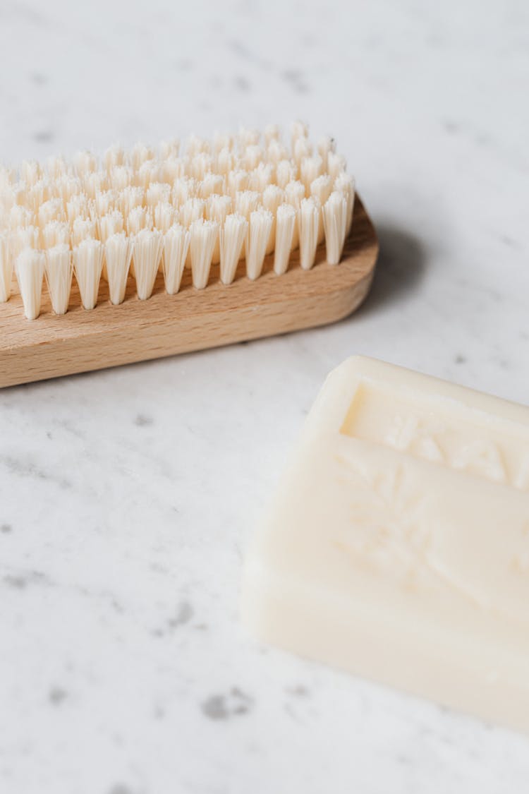 Cleaning Brush And Soup On Marble Table