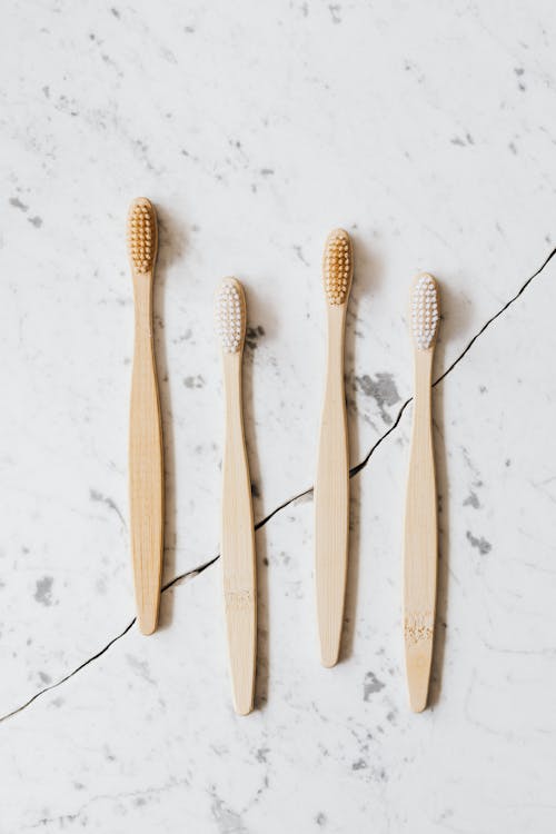 Free Brown Wooden Toothbrush on White Background Stock Photo