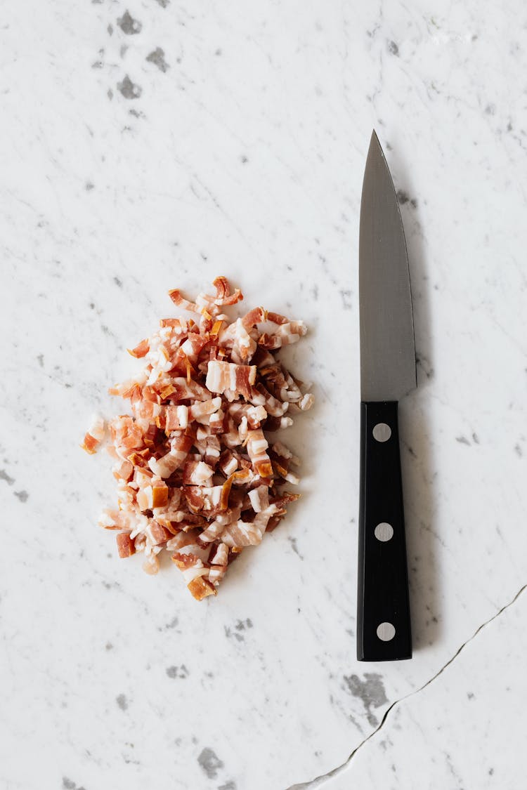 Heap Of Cut Bacon And Kitchen Knife