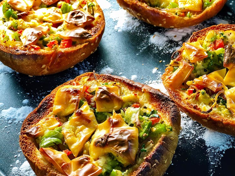 Delicious Mini Bread Pizzas Served On Board