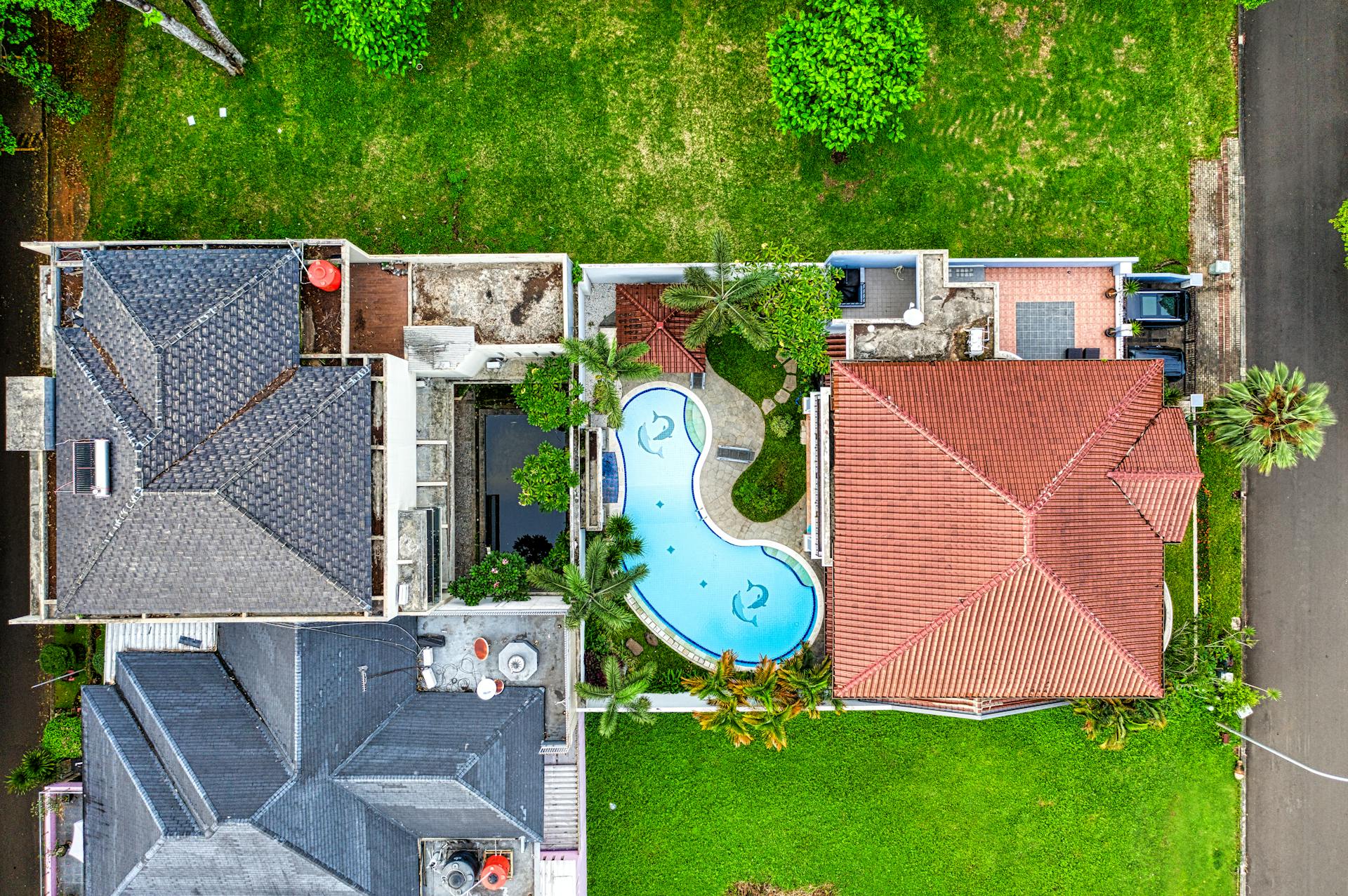 Aerial photograph showcasing luxurious homes and a pool in Banten, Indonesia.