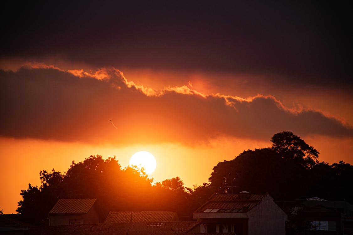 Amazing sunset sky over countryside cottages