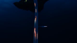 Bridge over dark river at night