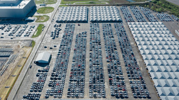 Aerial Photography Of Cars Parked On Automobile Storage Facility