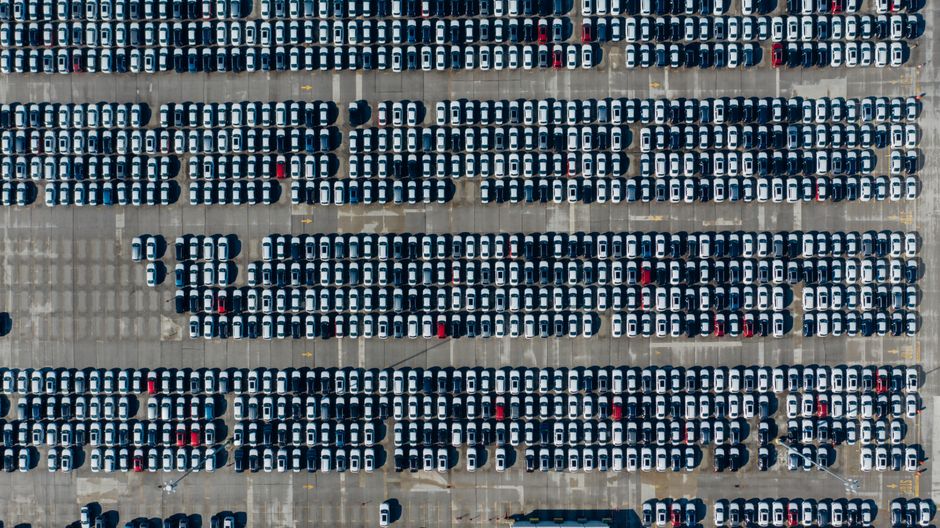 A top-down view of a large parking lot filled with rows of parked cars in Chattanooga, TN.