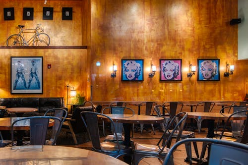 Interior of old fashioned cafe with vintage furniture and photos