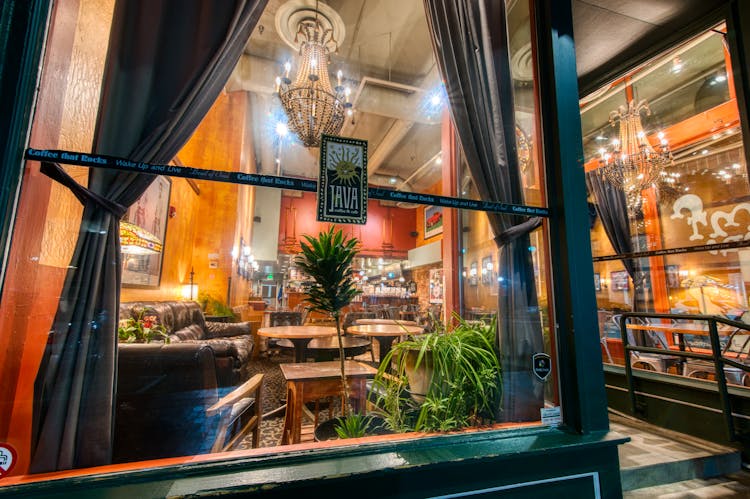 Classic Interior Of Cafe With Vintage Chandeliers And Furniture