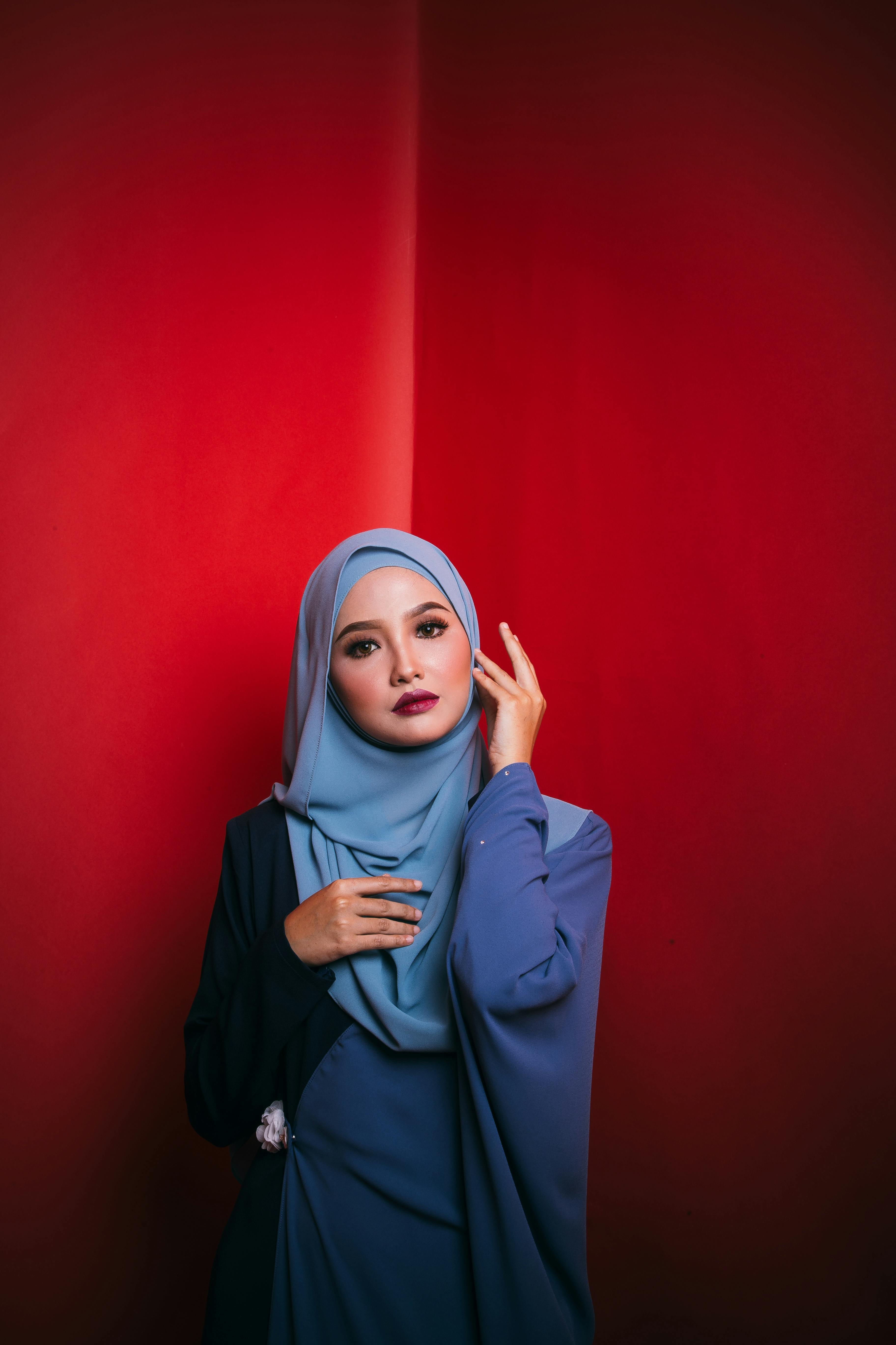 Woman in blue white and red hijab photo – Free Man alone Image on