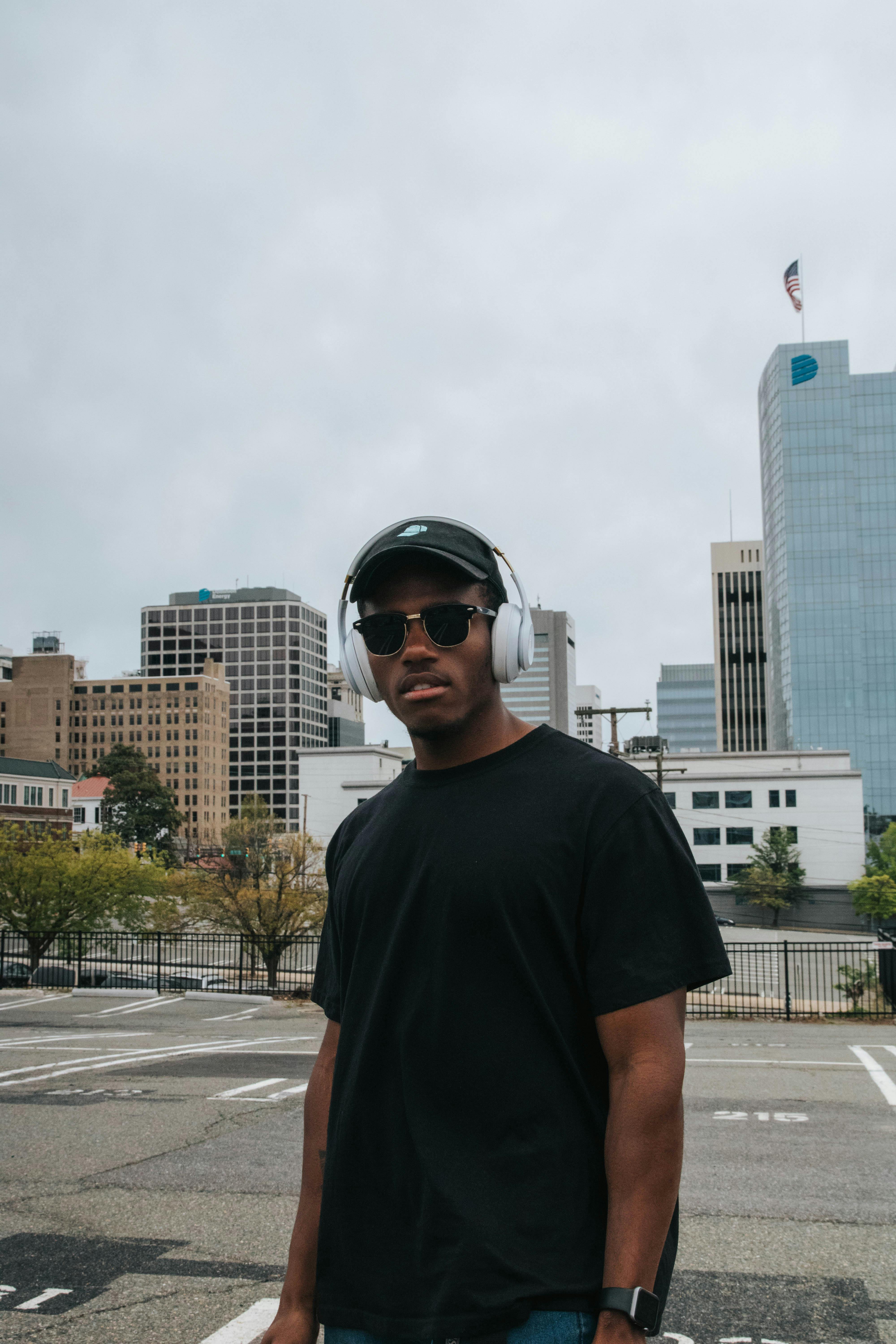 Man in Black Crew Neck T-shirt Wearing Black Sunglasses · Free Stock Photo