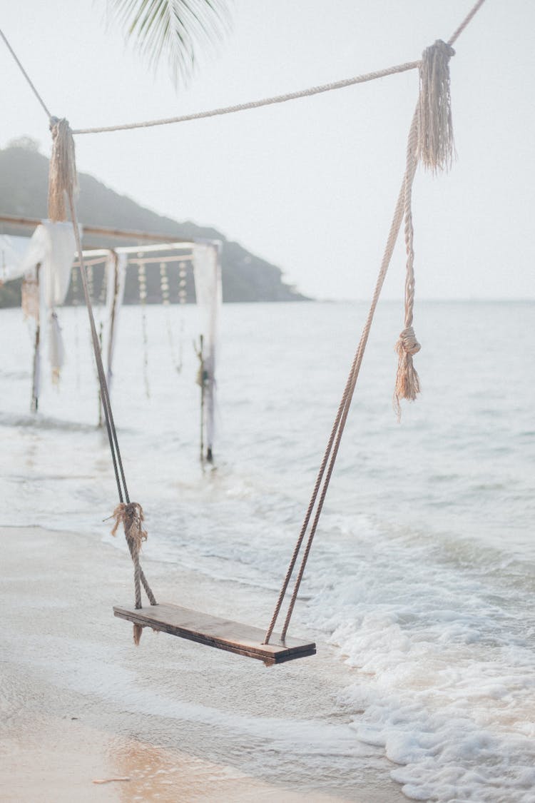 Rope And Plank Swing On Beach