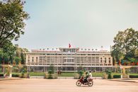 People on a Motorcycle near the Independence Palace in Vietnam