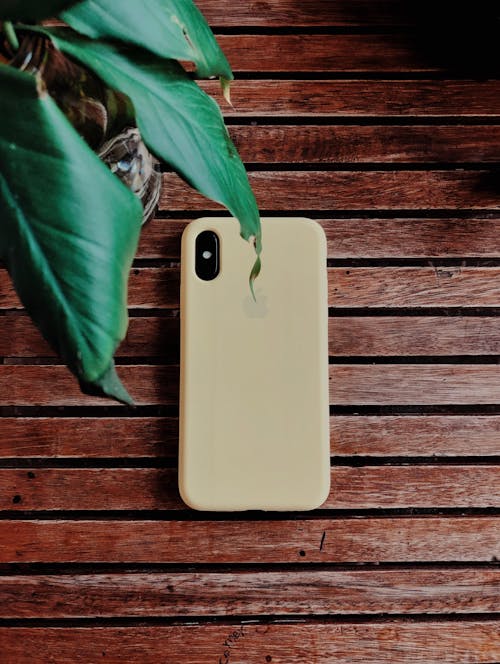 Beige Iphone Case on Brown Wooden Surface