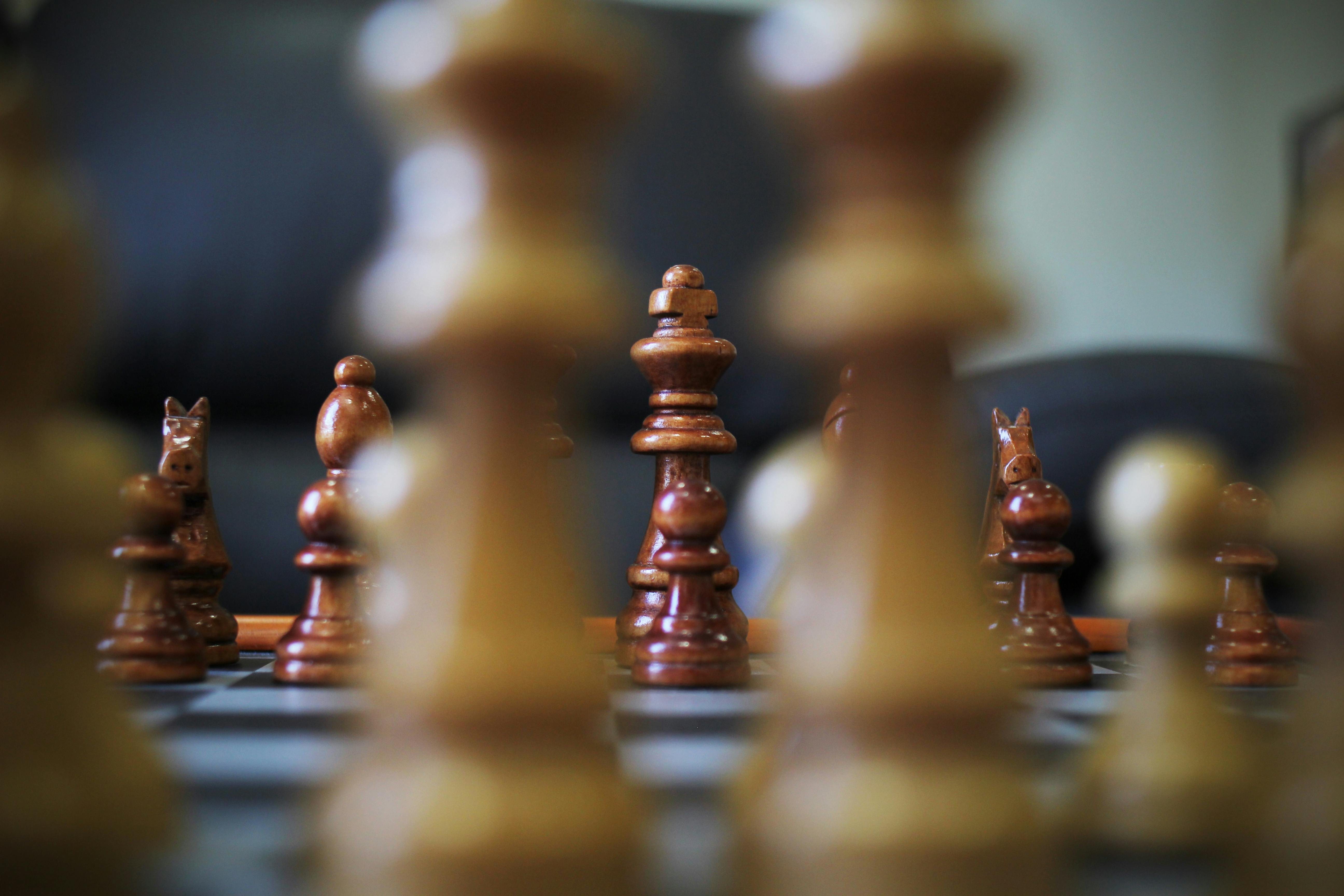 Close-up of chess game and chess pieces on table 4k from Pikwizard