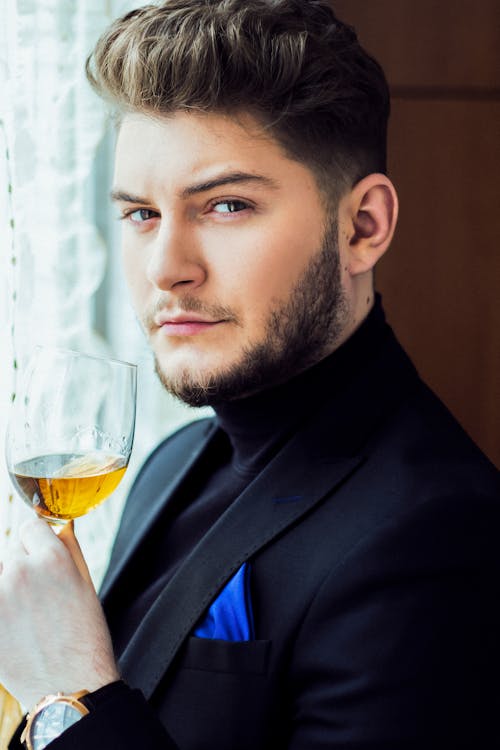 Confident man with glass of wine