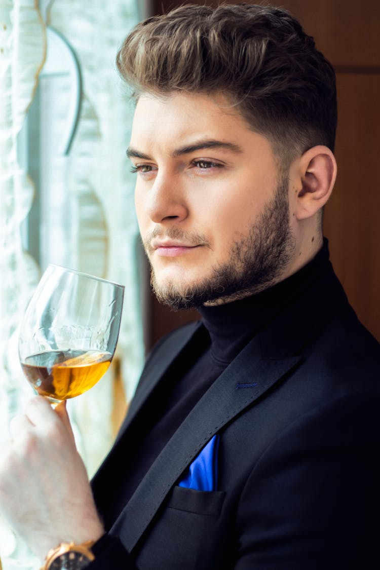 Content Man With Glass Of Wine