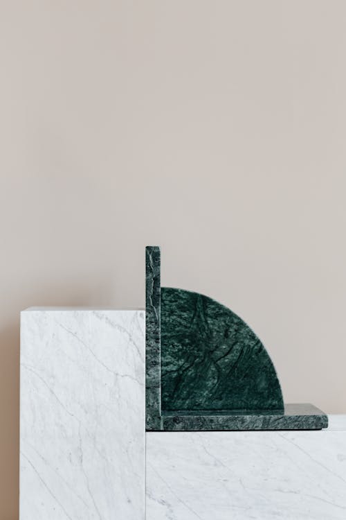 Stylish green bookend on marble table