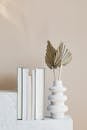 Geometric marble shelf with books and decorative vase