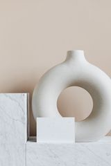 Round ceramic vase on a marble shelf — photo by kaboompics.com on Pexels