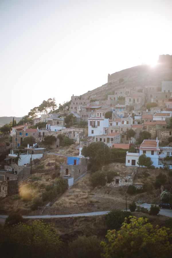 Whitewashed hillside village above the groves — photo by Anastasia Shuraeva on Pexels