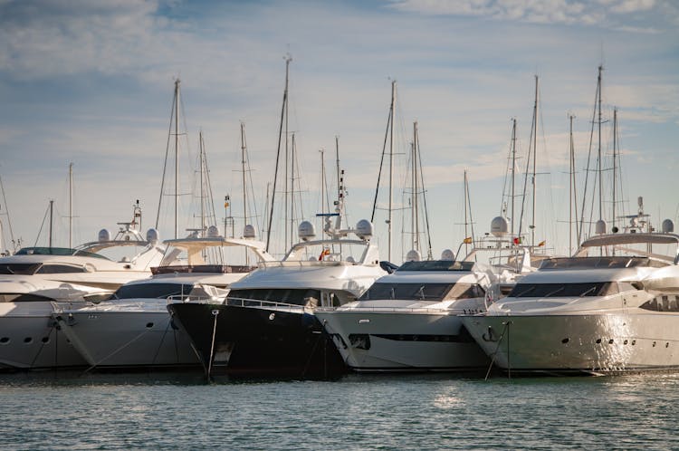 Five Yachts On Body Of Water